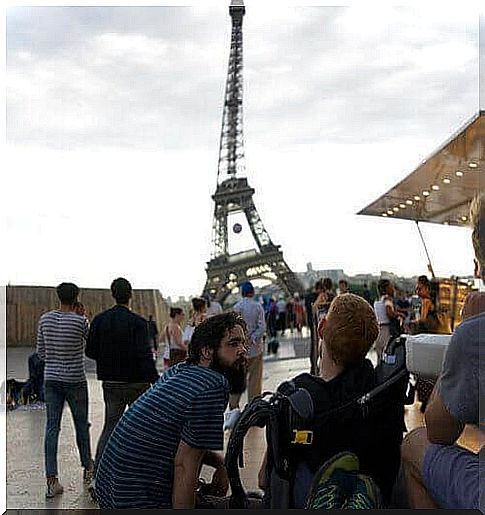 Kevan Chandler in Paris watching the Eiffel Tower.