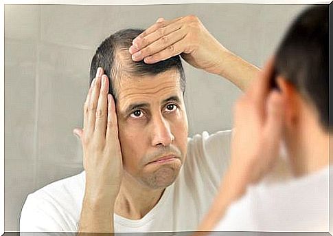 man mourning baldness