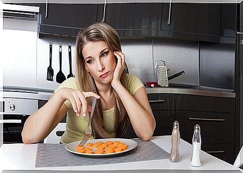 woman eating a carrot